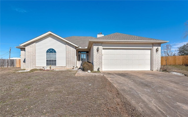 single story home featuring brick siding, a chimney, concrete driveway, fence, and a garage