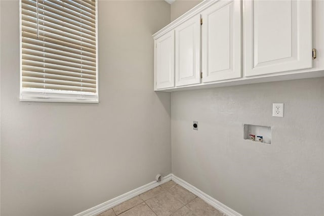 laundry area with cabinet space, light tile patterned floors, baseboards, washer hookup, and electric dryer hookup