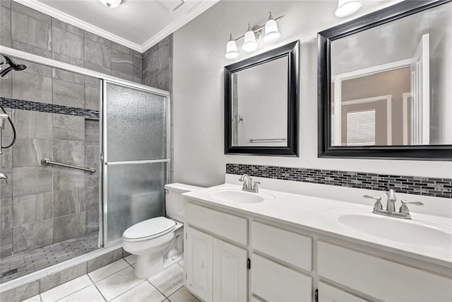 full bath featuring crown molding, a stall shower, a sink, and toilet