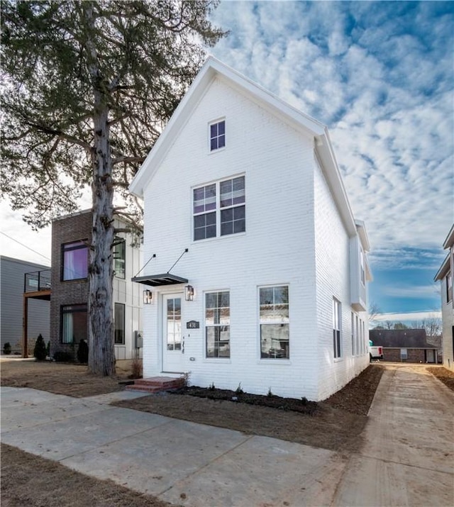 view of front of house featuring brick siding