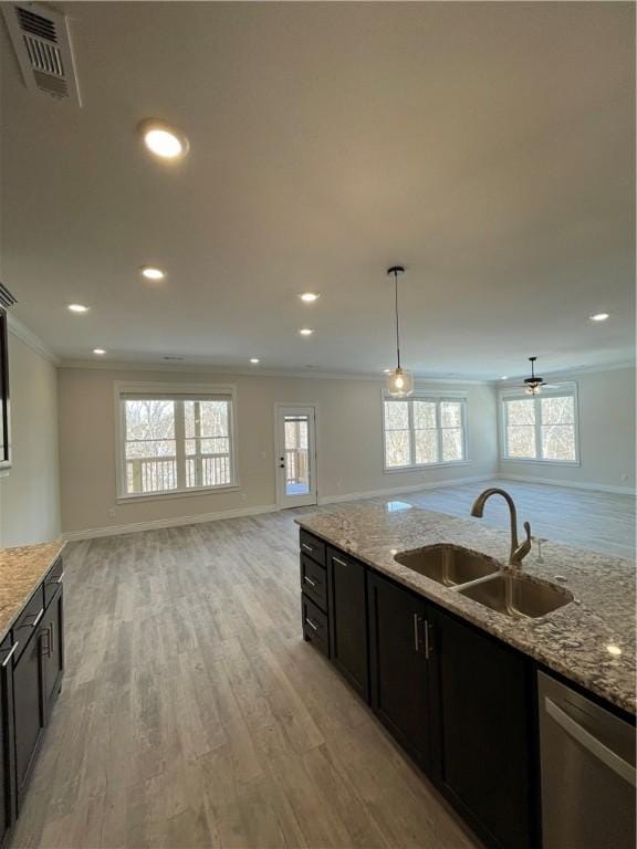 5 Burns Cir, Bella Vista, AR 72714 - kitchen with a sink, open floor plan, stainless steel dishwasher, ornamental molding, and light wood finished floors