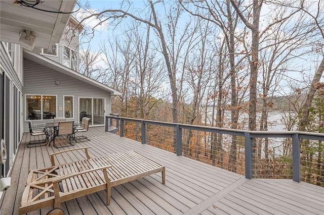 deck with outdoor dining area