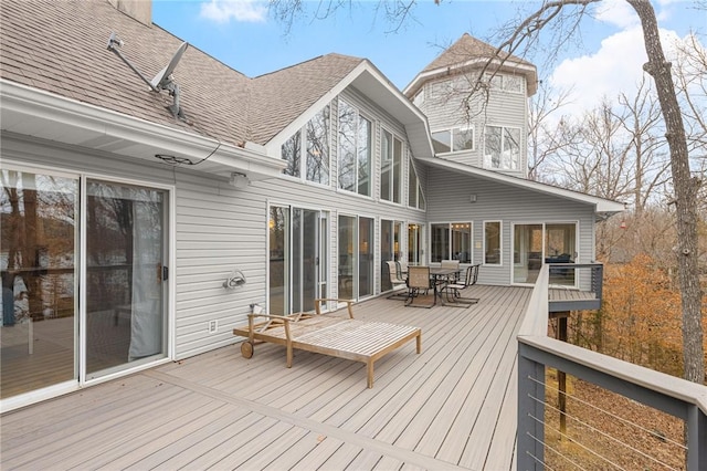 wooden terrace with outdoor dining area