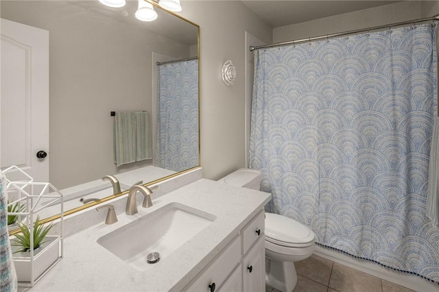 bathroom featuring vanity, toilet, and tile patterned floors