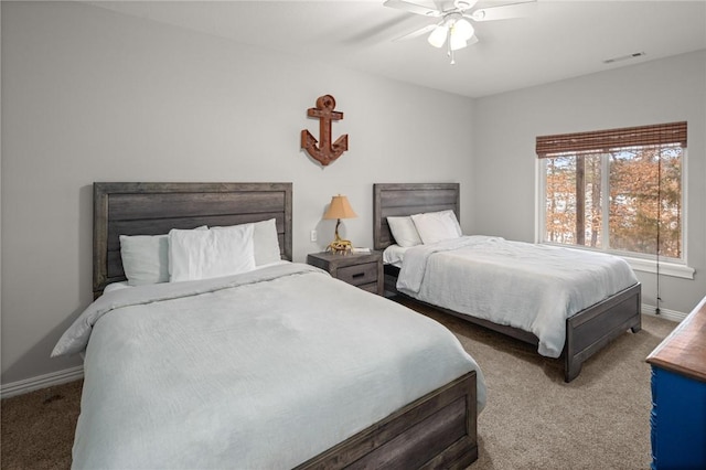 bedroom featuring ceiling fan, carpet, visible vents, and baseboards