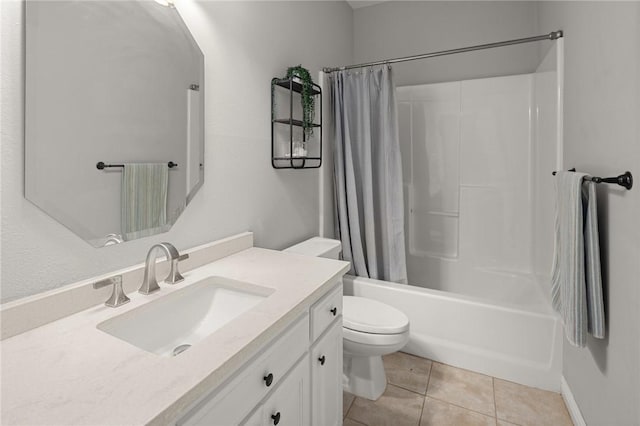 bathroom with shower / bath combo with shower curtain, vanity, toilet, and tile patterned floors