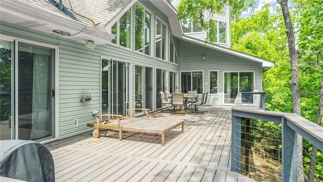 wooden deck featuring outdoor dining area