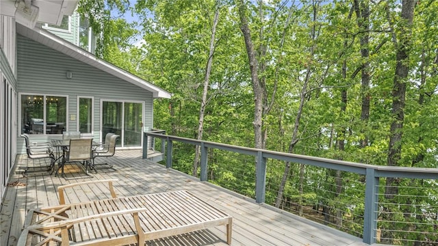deck with outdoor dining area