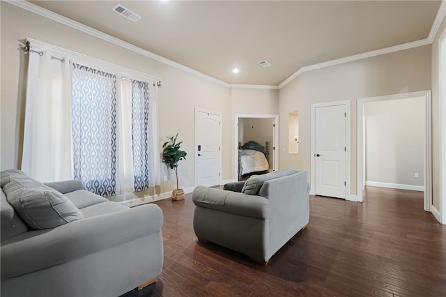 living room featuring baseboards, visible vents, dark wood-type flooring, and ornamental molding