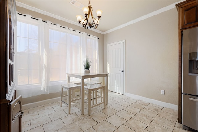 dining room with plenty of natural light, crown molding, baseboards, and a notable chandelier