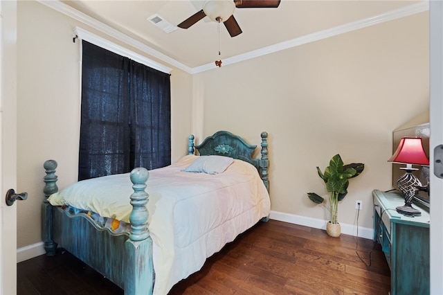 bedroom featuring baseboards, crown molding, wood finished floors, and visible vents