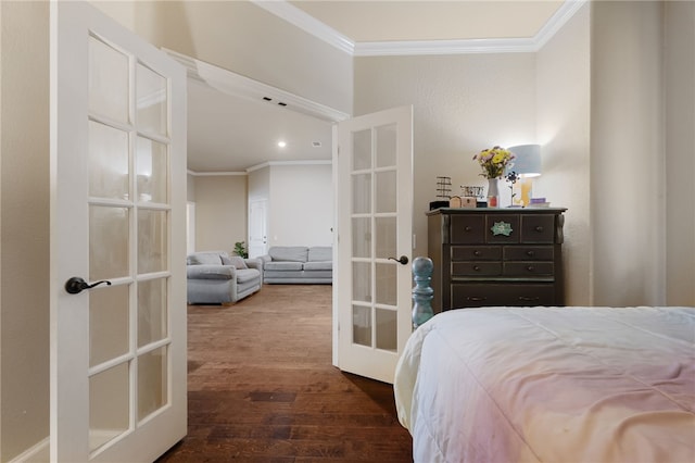 bedroom with wood finished floors, ornamental molding, and french doors