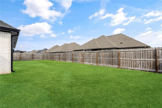 view of yard with a fenced backyard