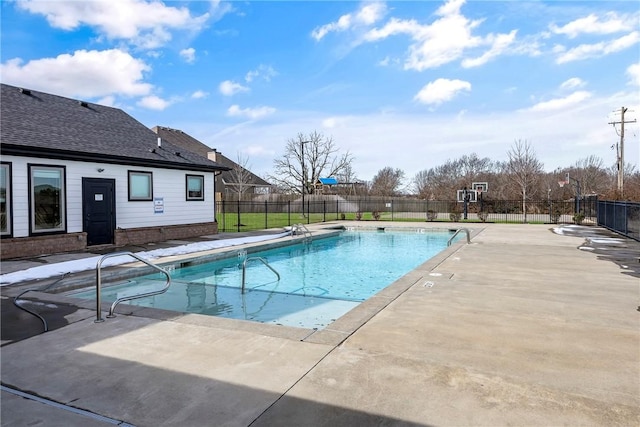 view of swimming pool with a patio, fence, and a fenced in pool