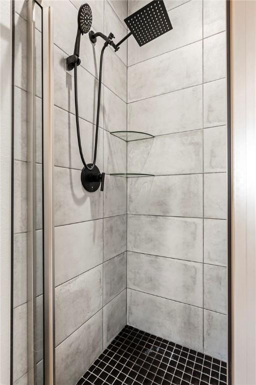 full bath with a shower stall