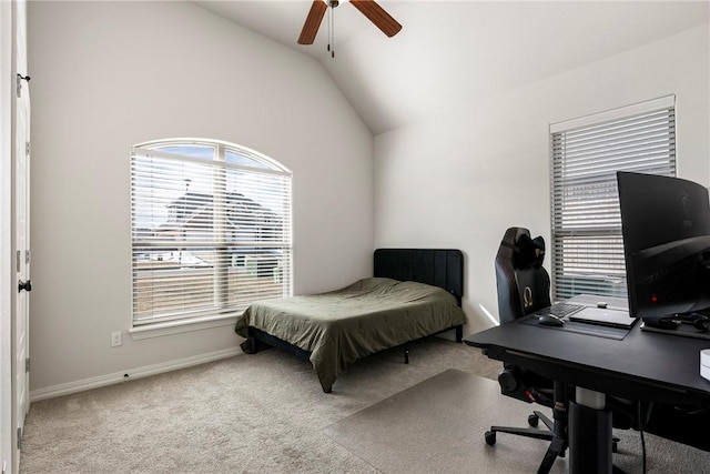 carpeted bedroom with baseboards, vaulted ceiling, and a ceiling fan