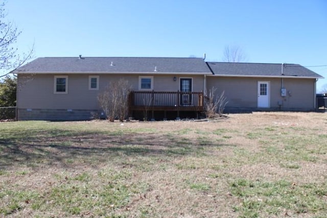 back of house with a yard and a wooden deck