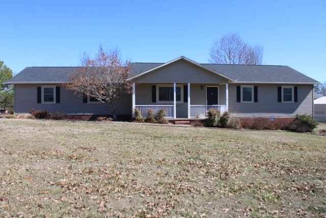 ranch-style home featuring a front lawn and a porch