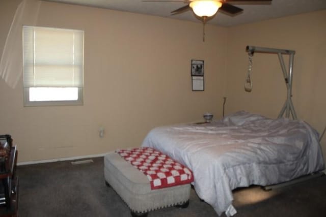 bedroom featuring carpet floors, ceiling fan, and baseboards