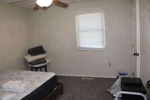 bedroom with a ceiling fan, carpet, and baseboards