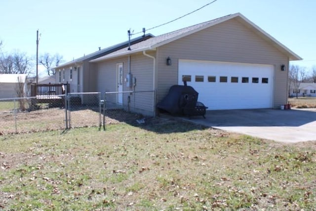 view of property exterior with a garage and fence