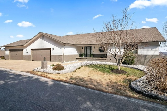 ranch-style house featuring a garage, driveway, and brick siding