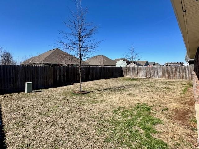 view of yard with a fenced backyard