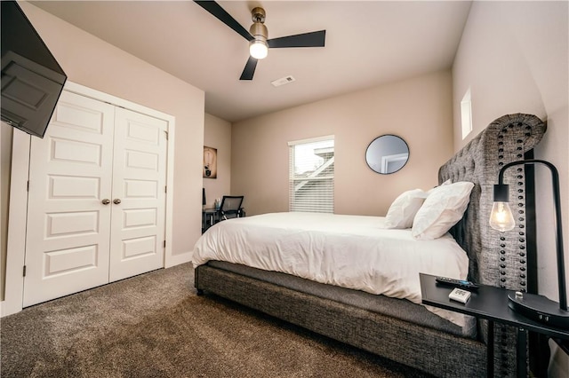 bedroom with ceiling fan, carpet floors, visible vents, baseboards, and a closet