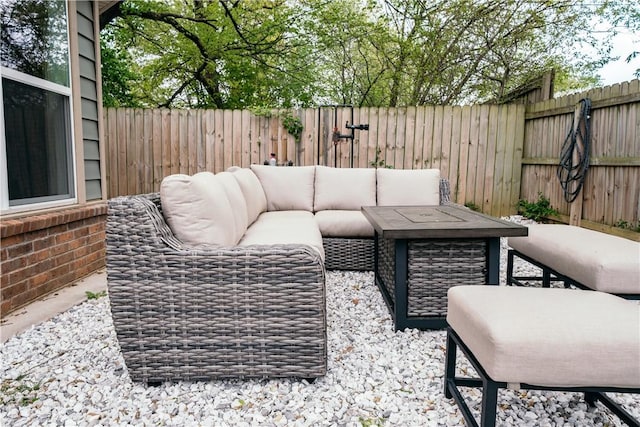 view of patio featuring a fenced backyard and an outdoor living space