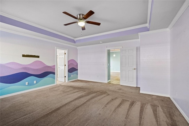 unfurnished bedroom with ensuite bathroom, baseboards, carpet, a raised ceiling, and crown molding