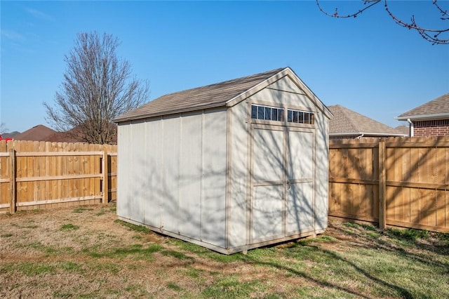 view of shed featuring a fenced backyard