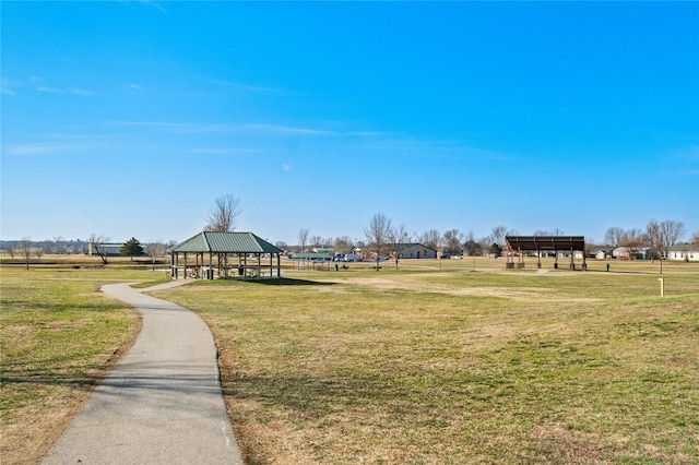 view of property's community with a gazebo and a lawn