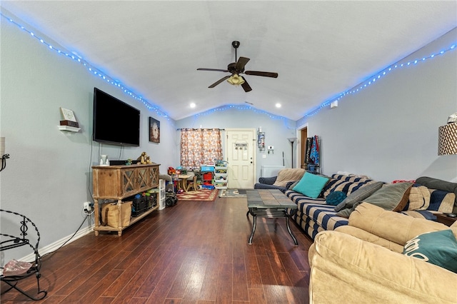 living room featuring ceiling fan, baseboards, vaulted ceiling, and wood finished floors