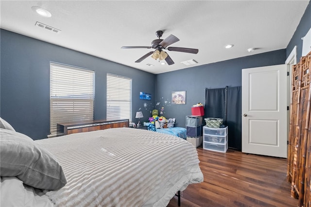 bedroom featuring ceiling fan, visible vents, wood finished floors, and recessed lighting