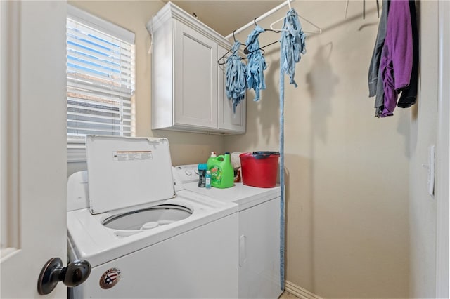 laundry room with cabinet space and washer and dryer