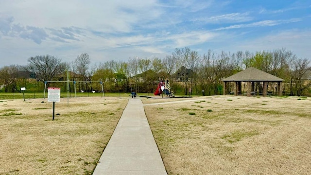 view of home's community with a gazebo, a yard, and playground community