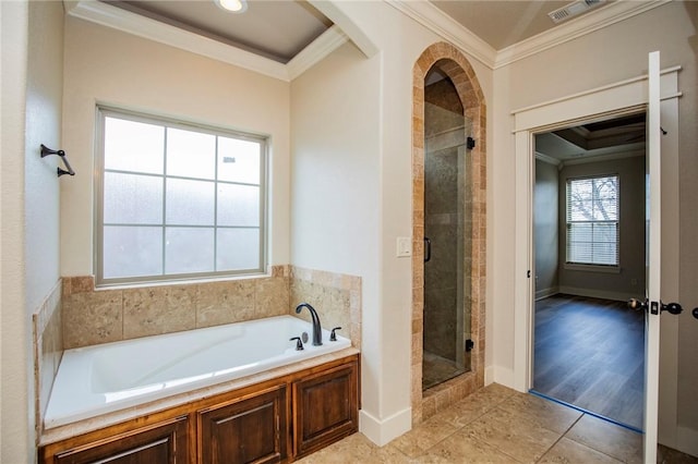 full bath with a stall shower, visible vents, ornamental molding, tile patterned floors, and a garden tub