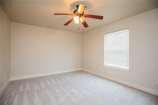 3601 SW Willowbrook Rd, Bentonville, AR 72713 - spare room featuring light carpet, baseboards, and ceiling fan
