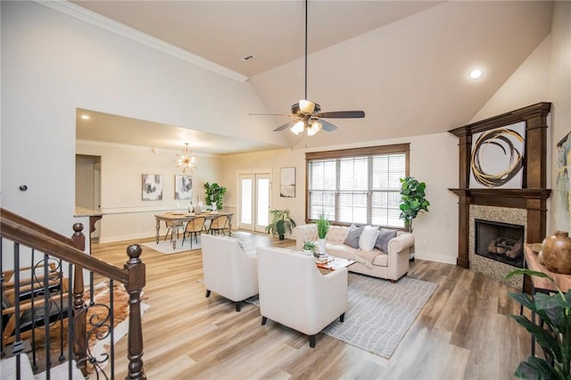 3601 SW Willowbrook Rd, Bentonville, AR 72713 - living area with plenty of natural light, a tile fireplace, light wood-style floors, and ceiling fan