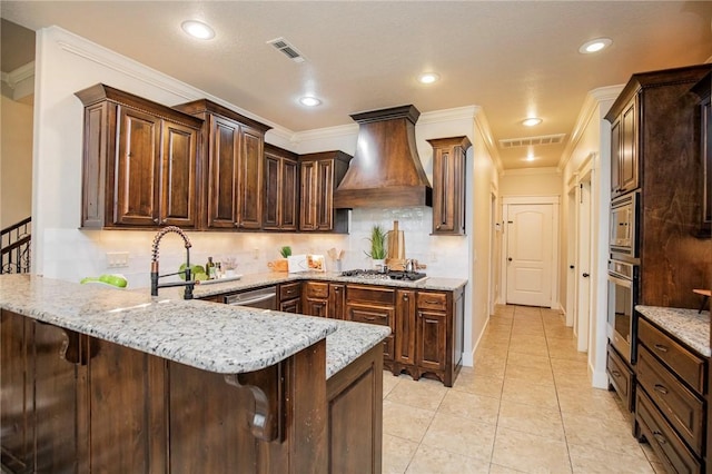 3601 SW Willowbrook Rd, Bentonville, AR 72713 - kitchen featuring a peninsula, visible vents, appliances with stainless steel finishes, and custom range hood