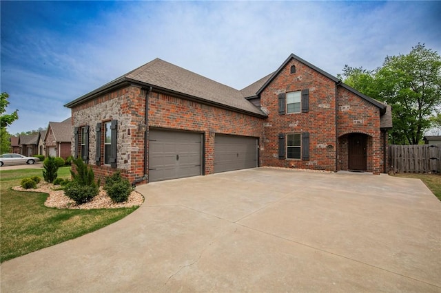 3601 SW Willowbrook Rd, Bentonville, AR 72713 - view of front of house featuring driveway, a shingled roof, fence, a garage, and brick siding