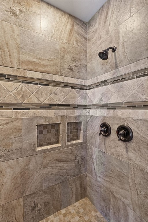 full bath with tiled shower