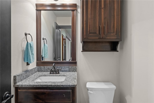 half bath with vanity and toilet