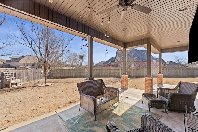 view of patio / terrace with ceiling fan, an outdoor hangout area, and a fenced backyard