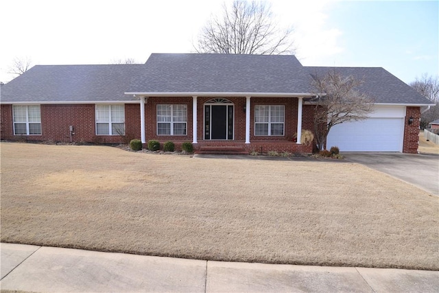 ranch-style home with a garage, concrete driveway, brick siding, and a shingled roof