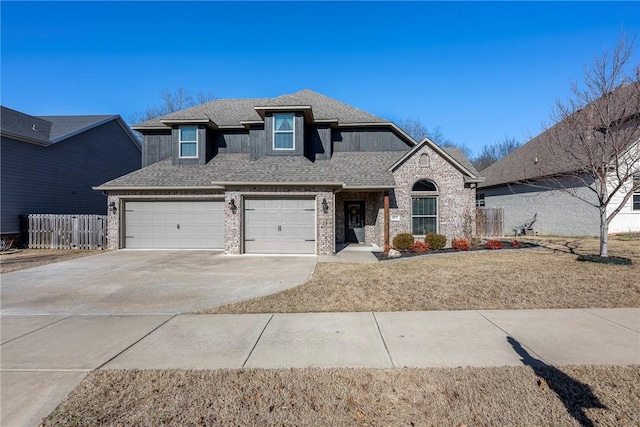 view of front facade featuring brick siding, fence, concrete driveway, and roof with shingles