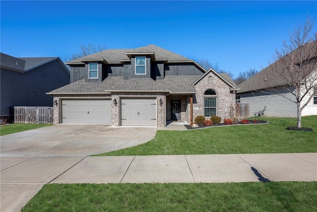 view of front of house featuring brick siding, a shingled roof, fence, driveway, and a front lawn