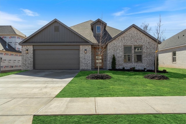 view of front of property with an attached garage, brick siding, concrete driveway, and a front yard