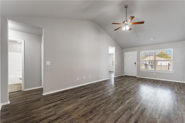 unfurnished living room featuring dark wood-style floors, lofted ceiling, baseboards, and a ceiling fan