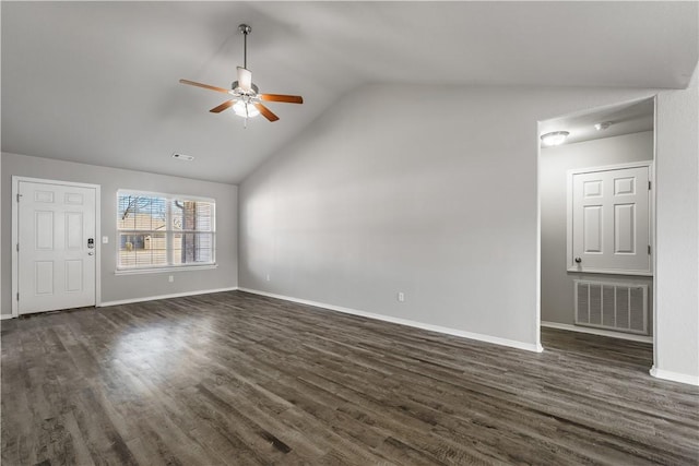 unfurnished living room with lofted ceiling, dark wood-style flooring, visible vents, baseboards, and a ceiling fan